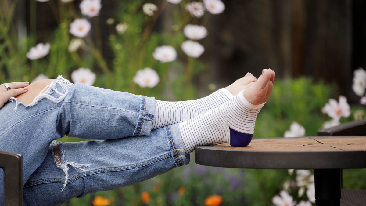 open toed compression socks worn by pregnant woman