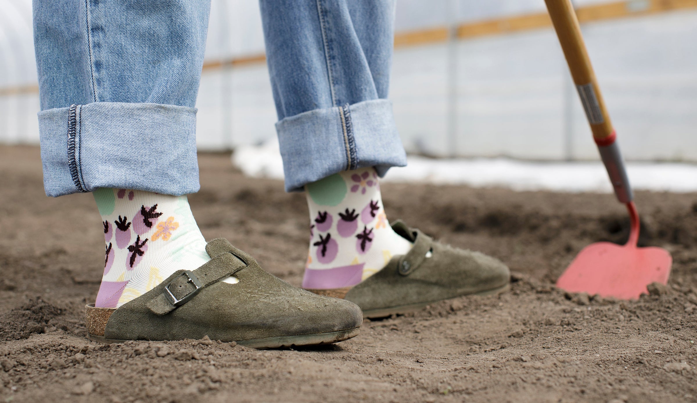 woman wearing compression while prepping the soil