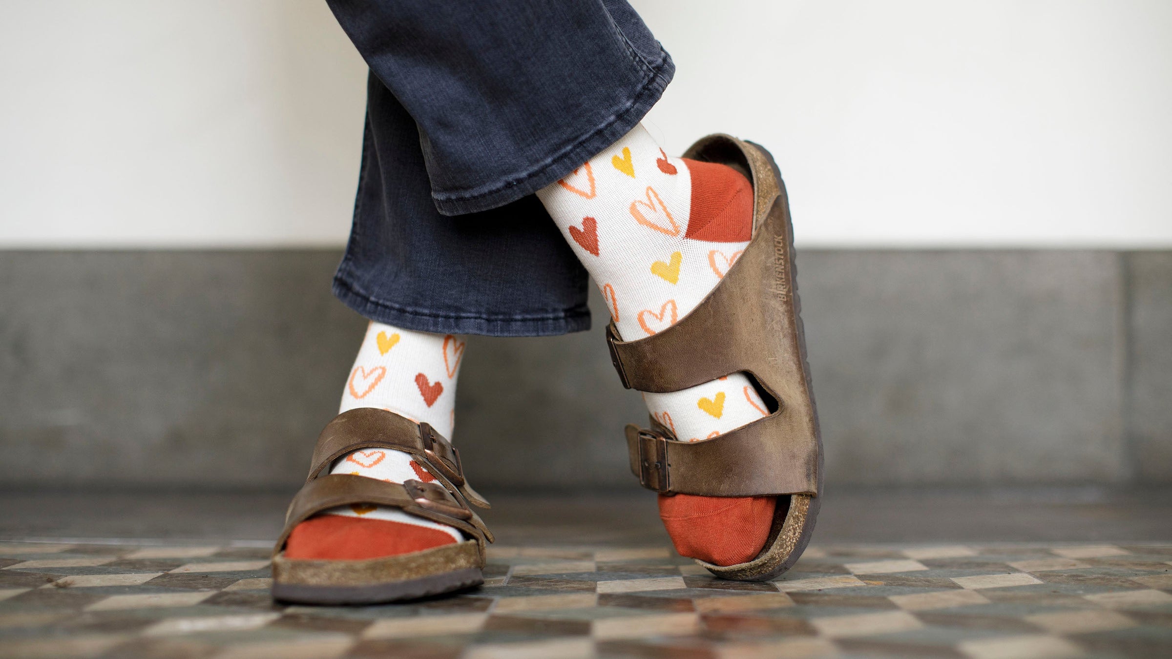 woman wearing merino wool compression socks inside her sandals