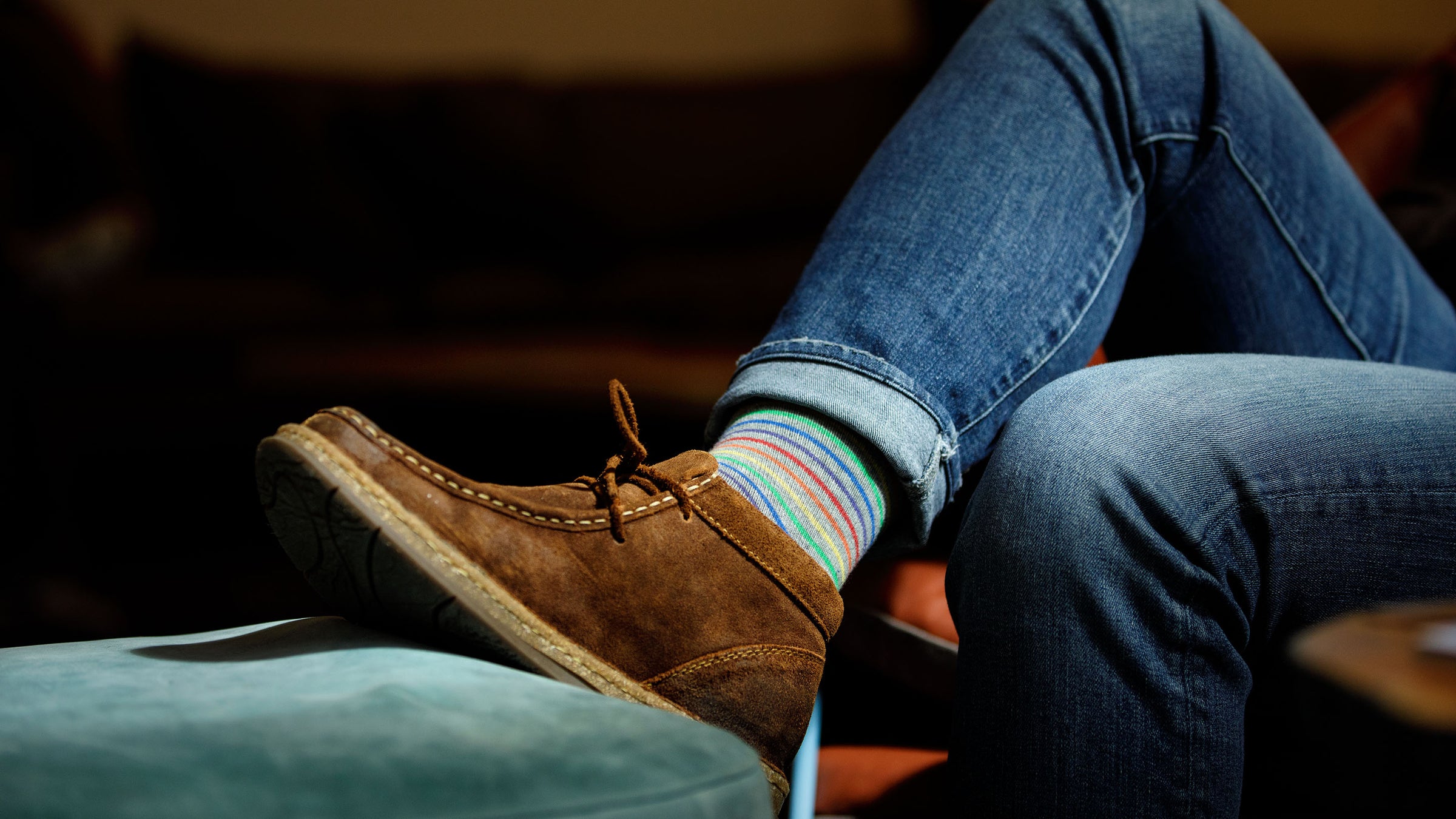 man wearing compression socks while browsing on his cellphone