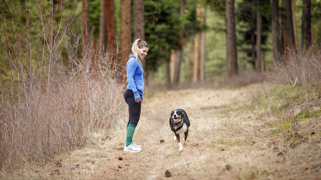 Woman wearing Compression socks for arthritis with her dog