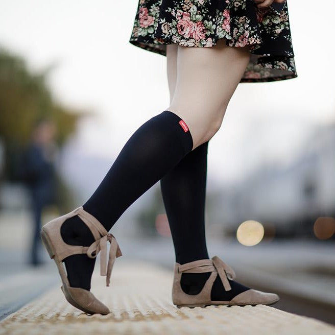 women walking wearing her Medical-grade 20-30 mmHg: Solid Black (Moisture-wick Nylon) compression socks